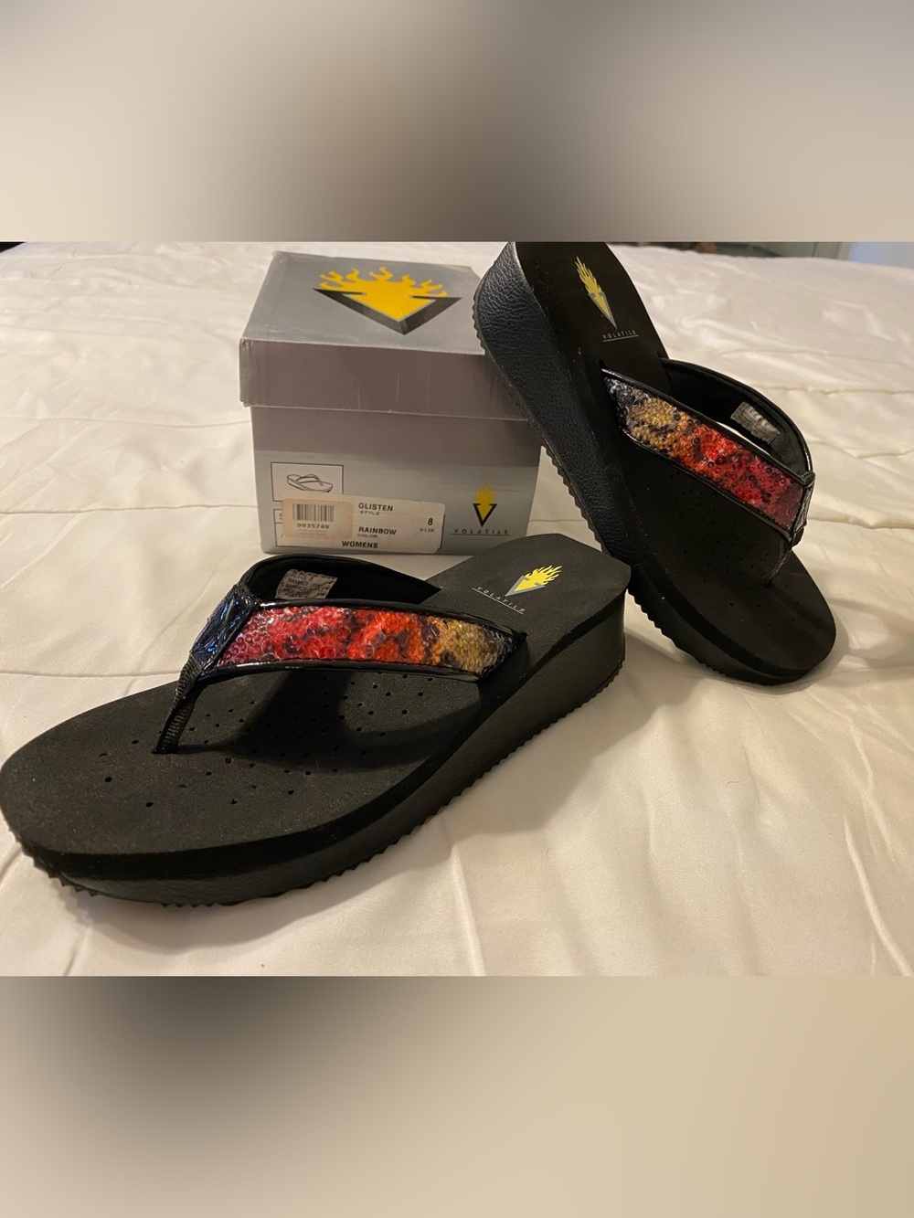 Volatile Black Platform Flip Flops with Red-Orange-Yellow Sequin Strap